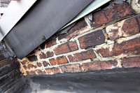 August 2021 - damaged bricks at south alley party wall and elevator shaft penthouse