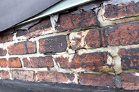August 2021 - damaged bricks at south alley party wall and elevator shaft penthouse