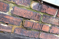 August 2021 - damaged bricks at south alley party wall and elevator shaft penthouse