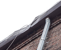 August 2021 - damaged gutter and bricks at north alley party wall
