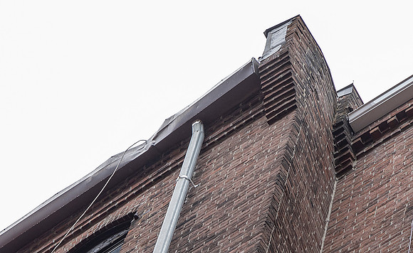 August 2021 - damaged gutter and bricks at north alley party wall