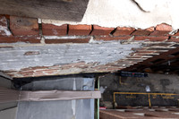 August 2021 - damaged bricks at south alley party wall and elevator shaft penthouse