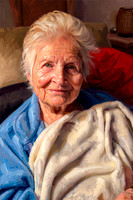 full color painting in the style of John Singer Sargent. Pose remains unchanged. Accurately overlay subject. Background remains unchanged. Primary lighting direction remains unchanged